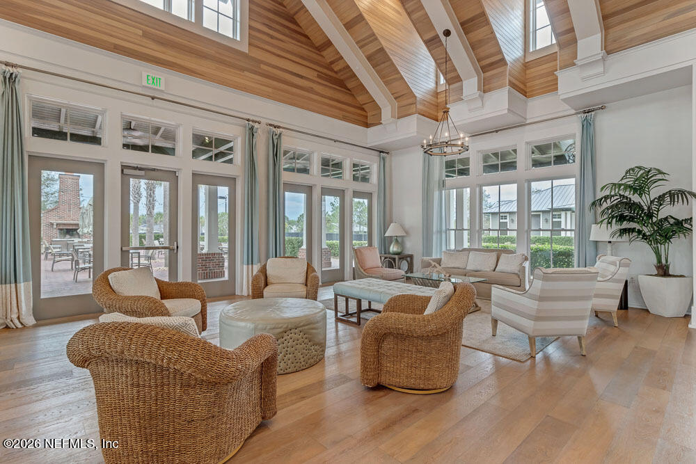 103 Riva Ridge Place St. Johns, FL 32259 - Photo 55 of 77 a living room with furniture large windows and wooden floor
