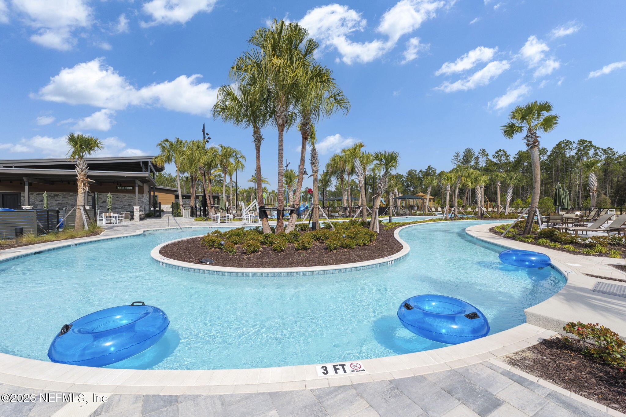 103 Riva Ridge Place St. Johns, FL 32259 - Photo 68 of 77 a view of a swimming pool with a table and chairs