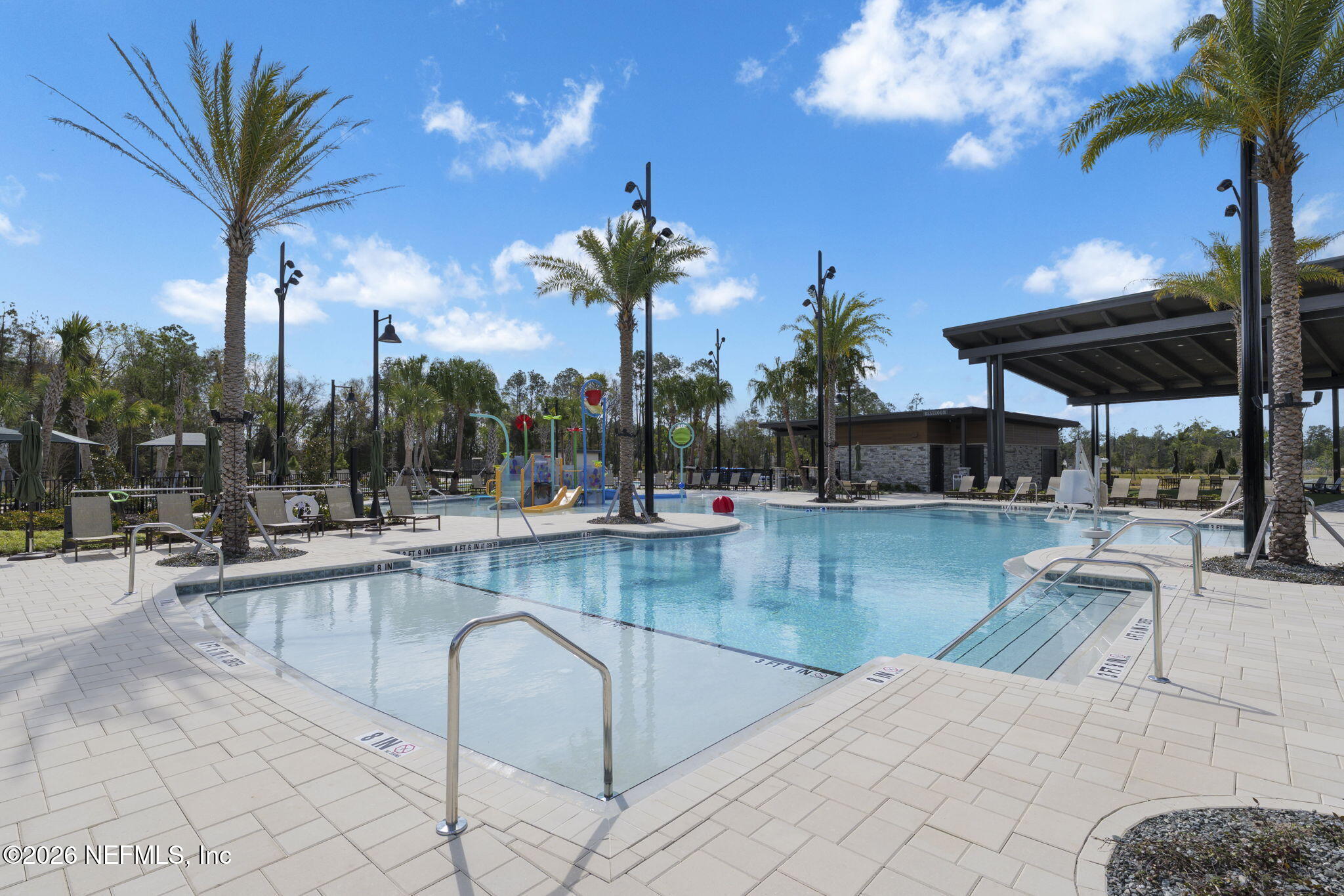 103 Riva Ridge Place St. Johns, FL 32259 - Photo 71 of 77 a view of a swimming pool and lounge chairs