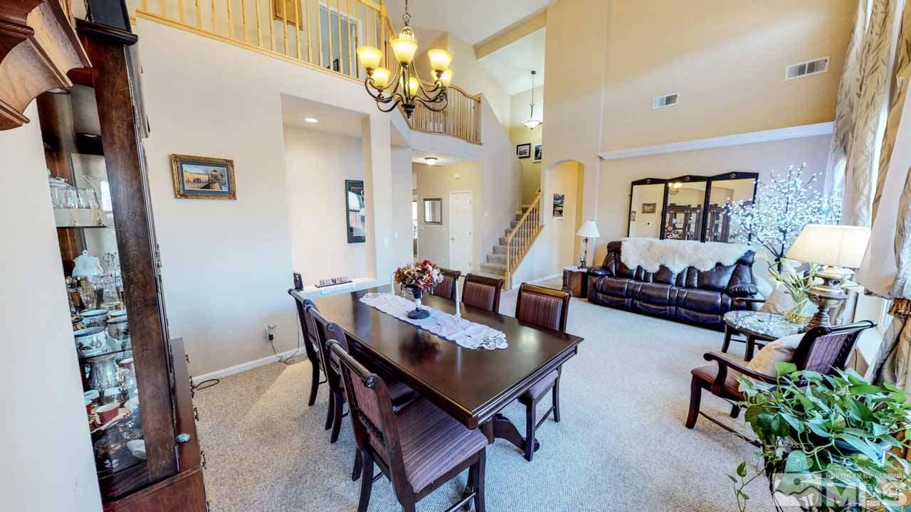 9980 Bandana Way Reno, NV 89521 - Photo 4 of 25 a view of a livingroom with furniture and a potted plant