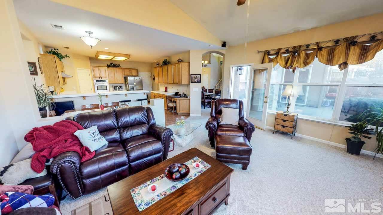 9980 Bandana Way Reno, NV 89521 - Photo 6 of 25 a living room with furniture and a mirror