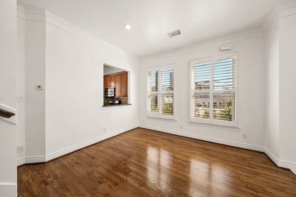 a view of an entryway with wooden floor