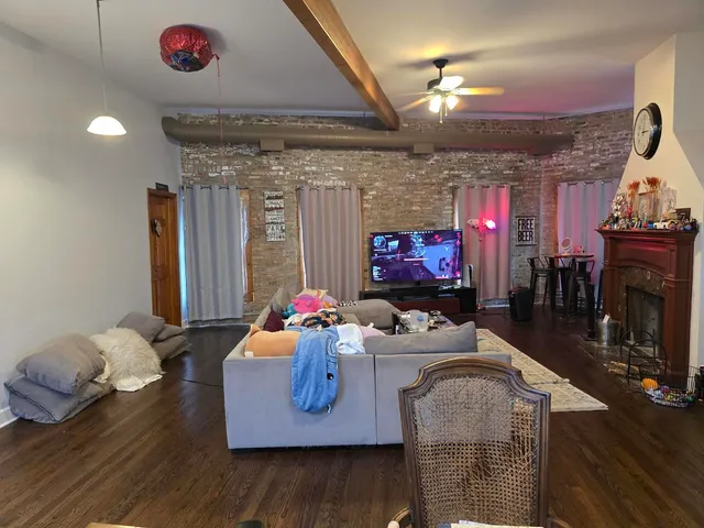 a room with furniture and a flat screen tv