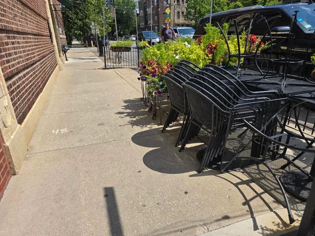 a view of a backyard with sitting area