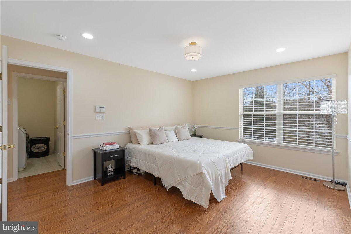 111 Windsor Pond Road Princeton Junction, NJ 08550 - Photo 16 of 29 a bedroom with a bed and a large window
