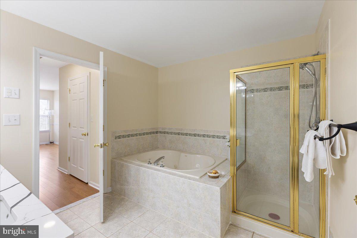 111 Windsor Pond Road Princeton Junction, NJ 08550 - Photo 18 of 29 a bathroom with a tub and shower
