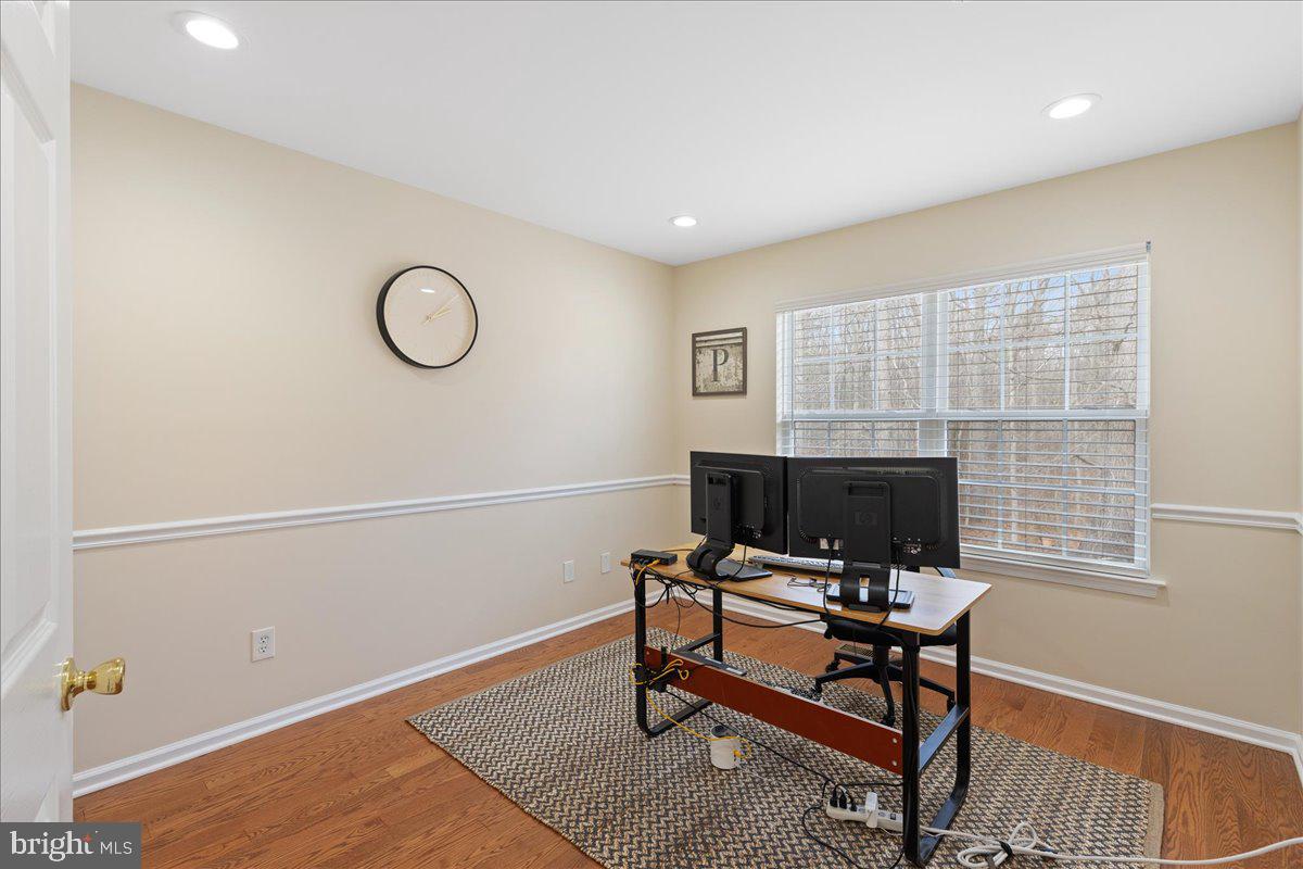 111 Windsor Pond Road Princeton Junction, NJ 08550 - Photo 19 of 29 a view of a workspace with furniture and a window