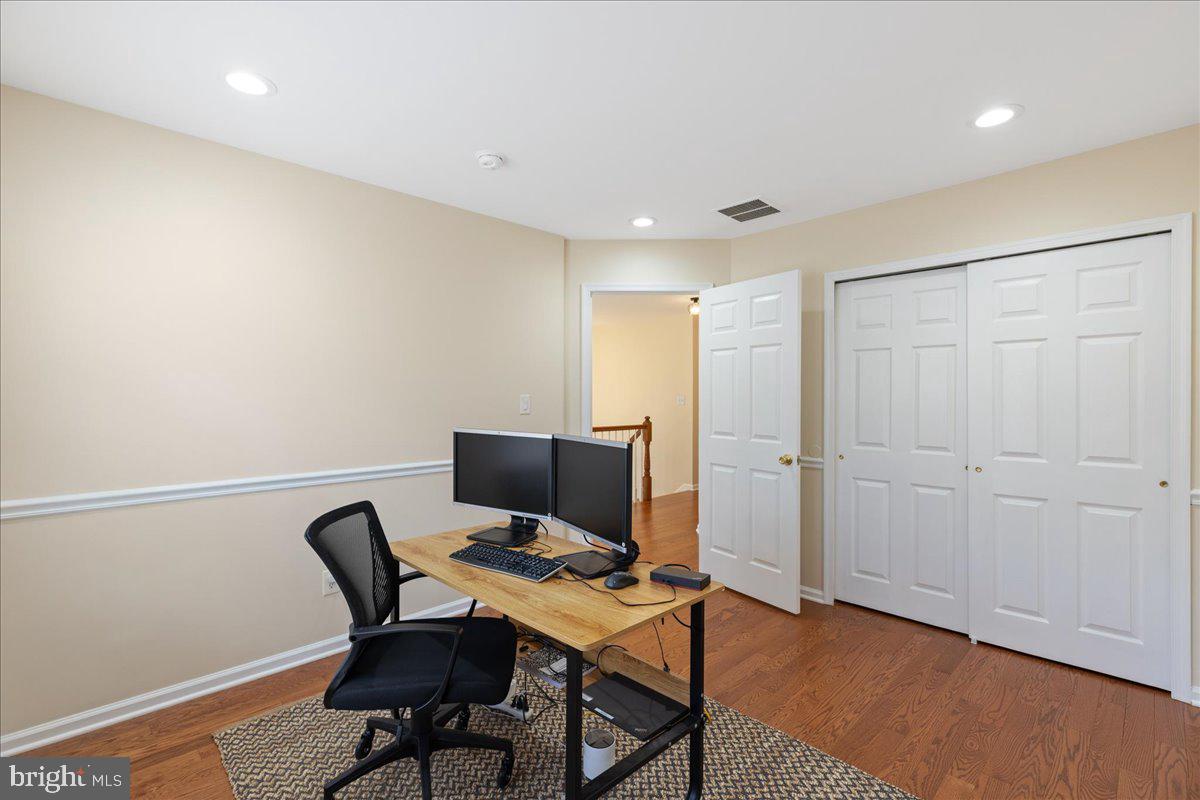 111 Windsor Pond Road Princeton Junction, NJ 08550 - Photo 20 of 29 a view of a workspace with furniture and wooden floor
