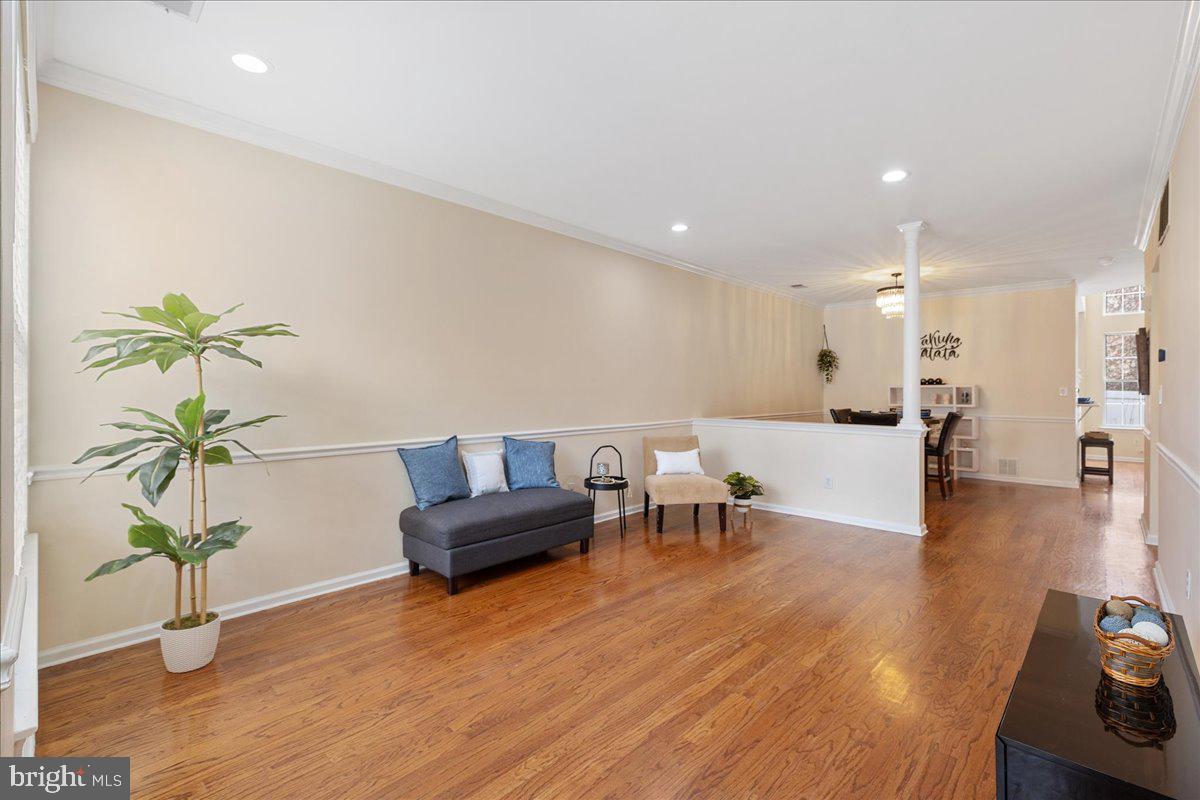 111 Windsor Pond Road Princeton Junction, NJ 08550 - Photo 3 of 29 a living room with furniture and a wooden floor