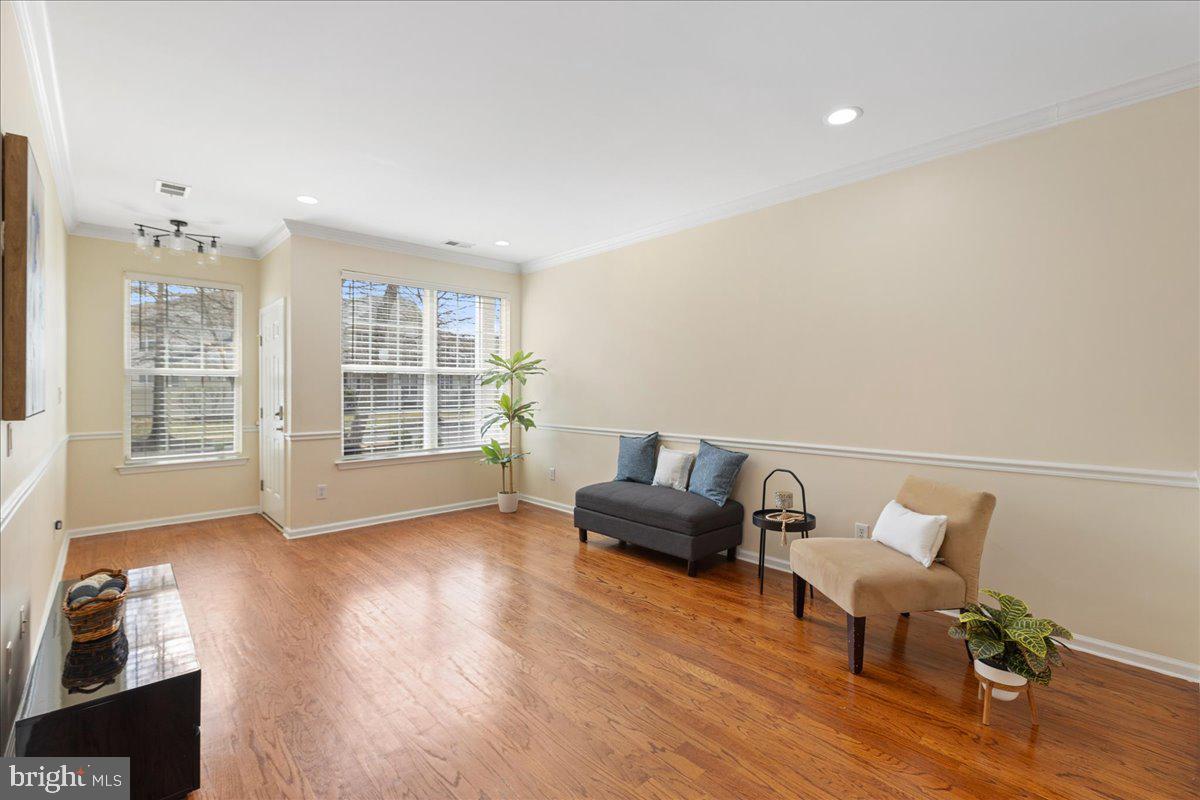 111 Windsor Pond Road Princeton Junction, NJ 08550 - Photo 4 of 29 a living room with furniture and wooden floor