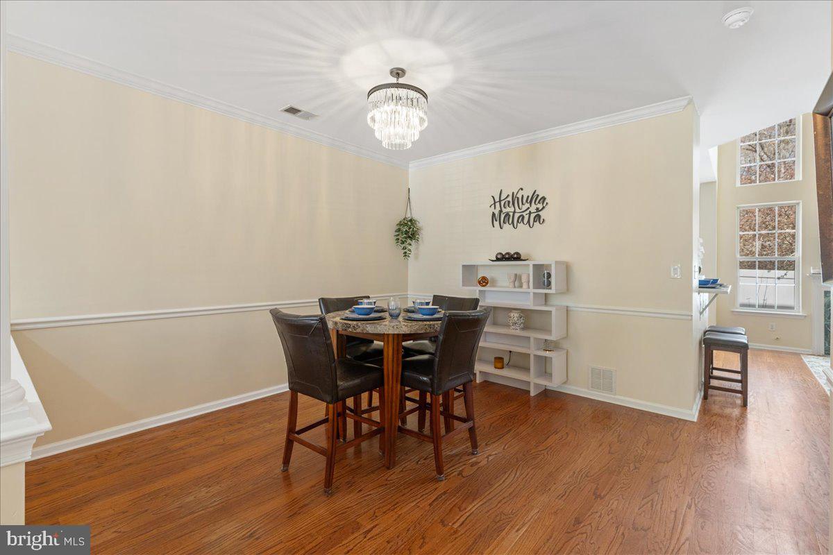 111 Windsor Pond Road Princeton Junction, NJ 08550 - Photo 5 of 29 a view of a dining room with furniture and wooden floor