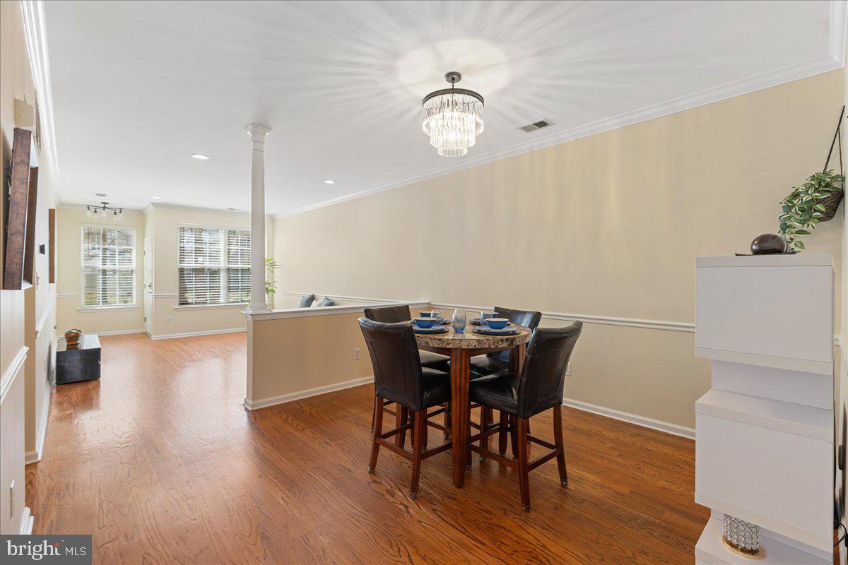 111 Windsor Pond Road Princeton Junction, NJ 08550 - Photo 6 of 29 a view of a dining room with furniture window and wooden floor