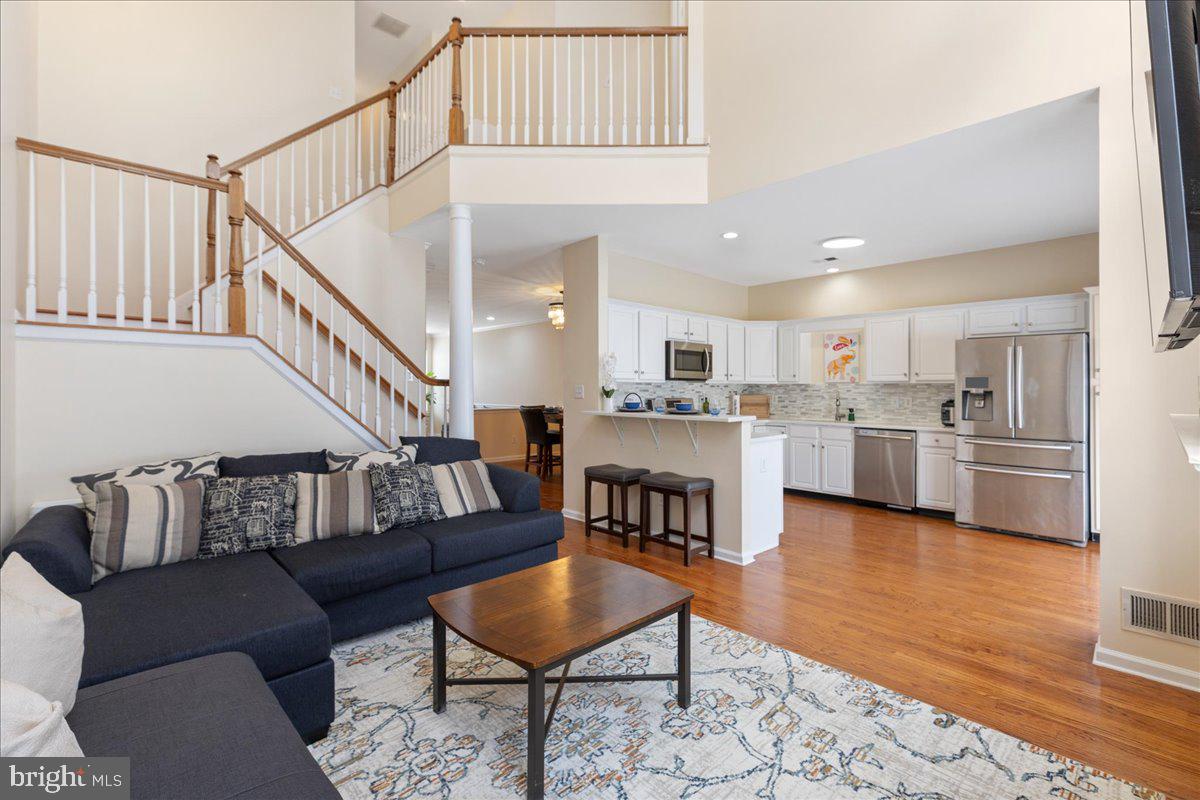 111 Windsor Pond Road Princeton Junction, NJ 08550 - Photo 8 of 29 a living room with furniture and kitchen view