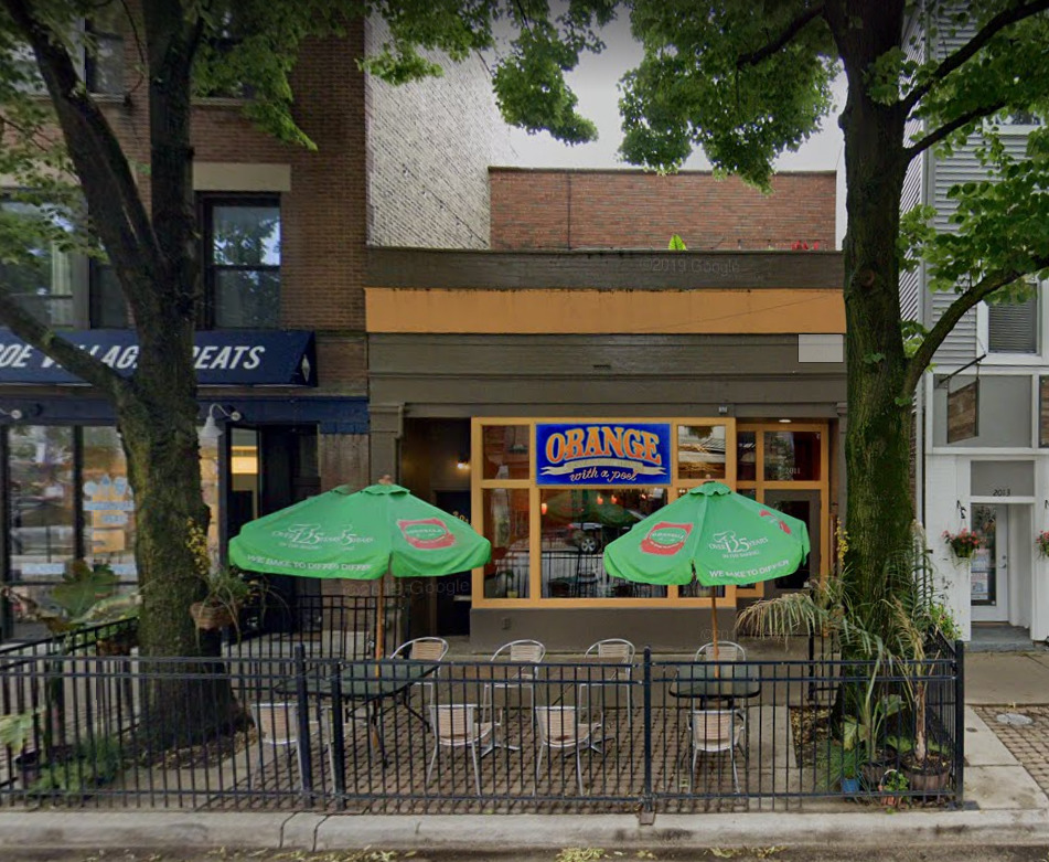 a view of a cafe with outdoor seating