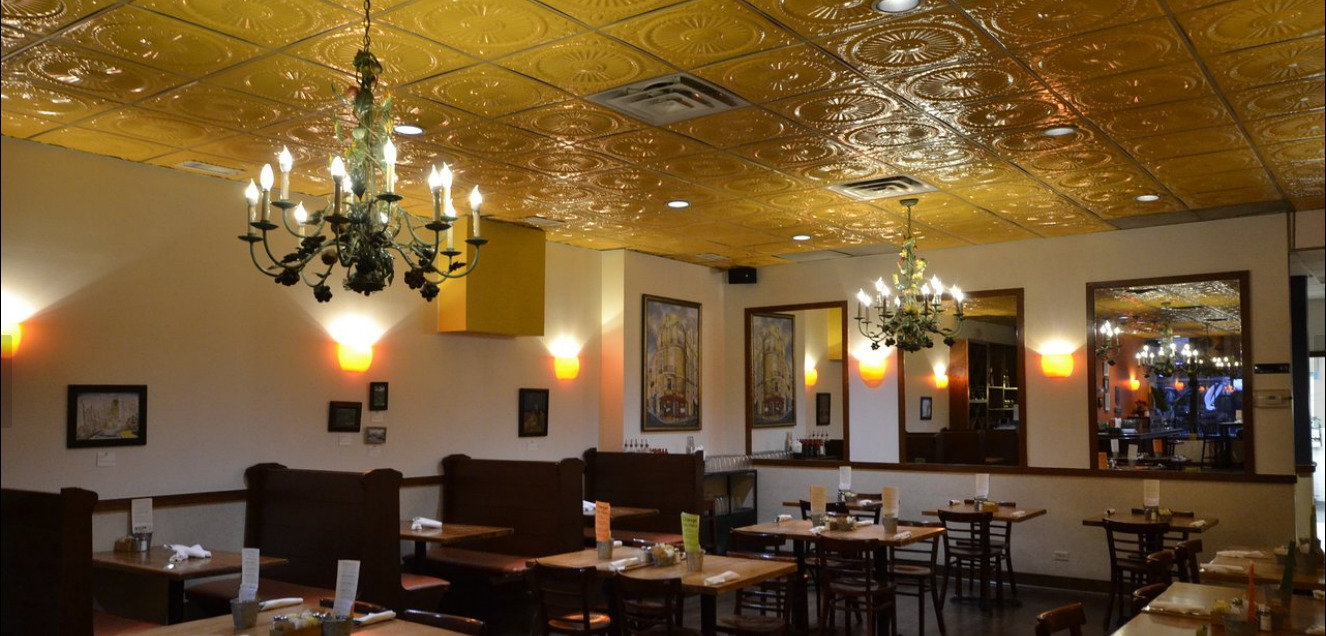 2011 West Roscoe Street Chicago, IL 60618 - Photo 4 of 8 a view of a dining room with furniture and chandelier