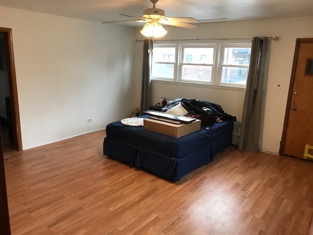 2011 West Roscoe Street Chicago, IL 60618 - Photo 5 of 8 a bedroom with a bed and window