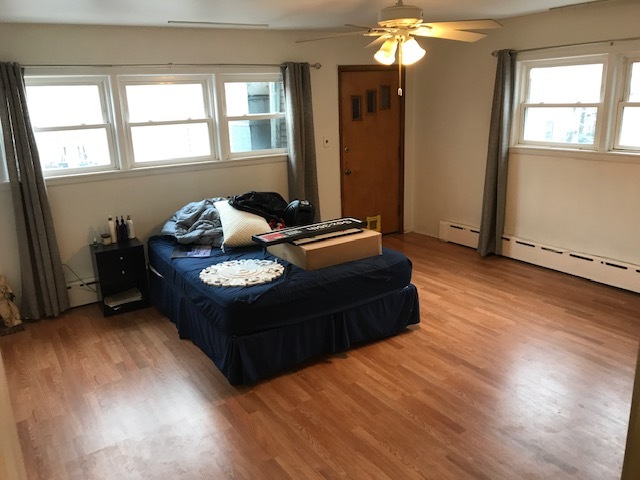 2011 West Roscoe Street Chicago, IL 60618 - Photo 7 of 8 a living room with furniture and window