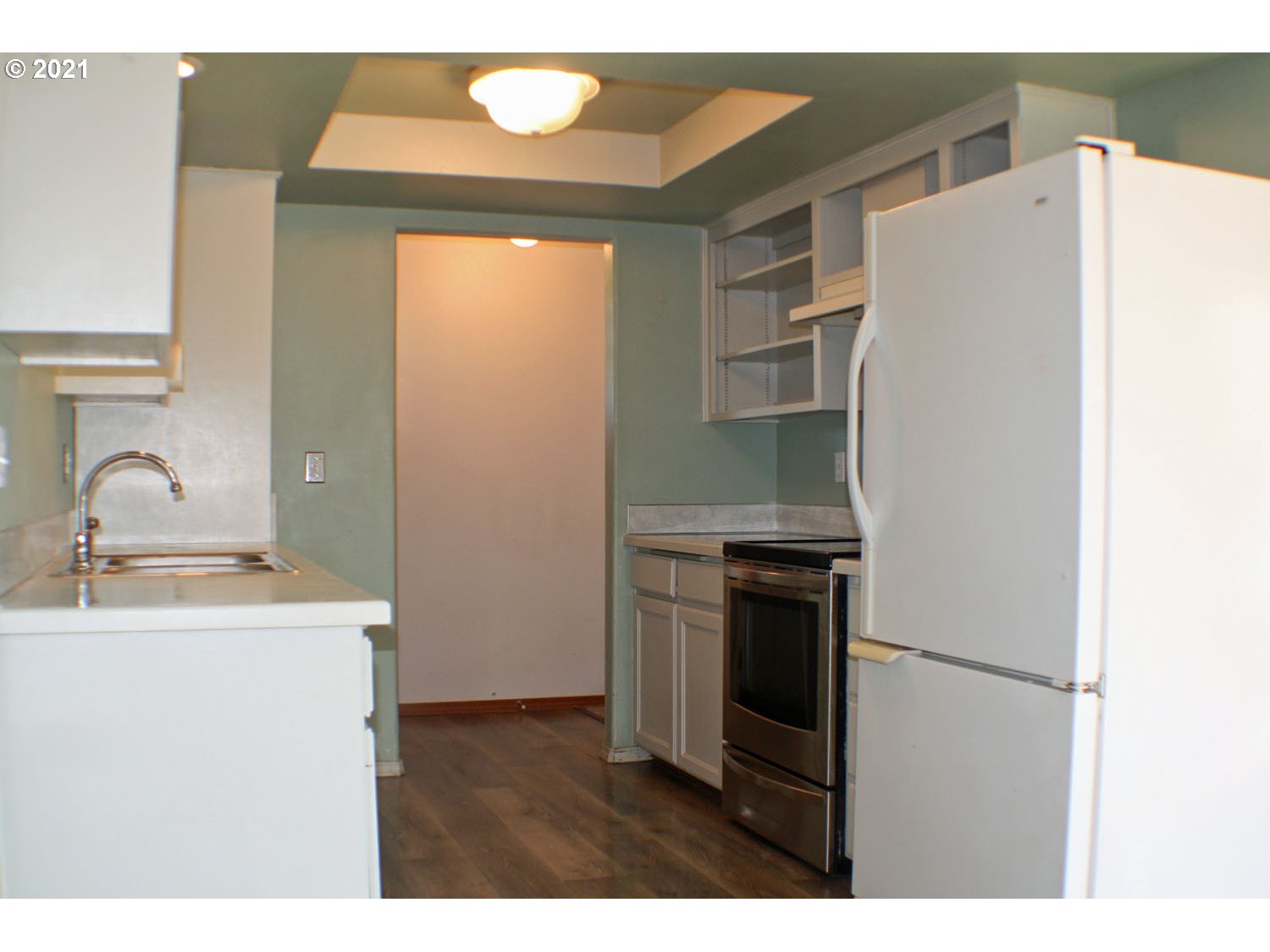 422 North 55th Street Springfield, OR 97478 - Photo 8 of 16 a kitchen with a refrigerator sink and stove