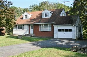 5643 Searsville Road Pine Bush, NY 12566 - Photo 1 of 1 a front view of a house with a garden