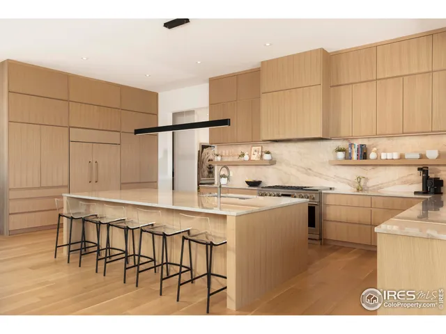 a kitchen with appliances cabinets and a sink