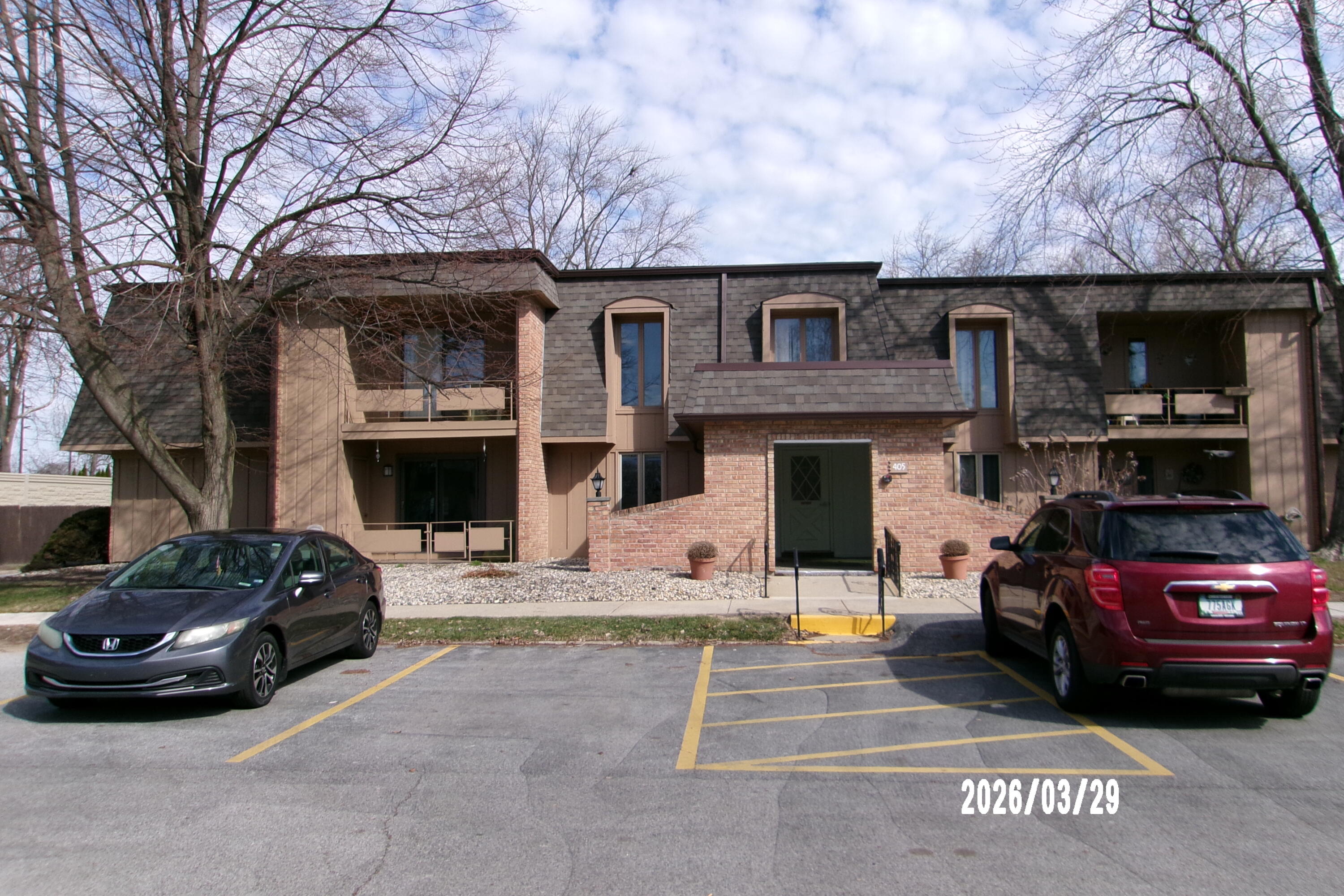 405 Old Stone Road, Unit E2 Munster, IN 46321 - Photo 1 of 20 a car parked in front of a building