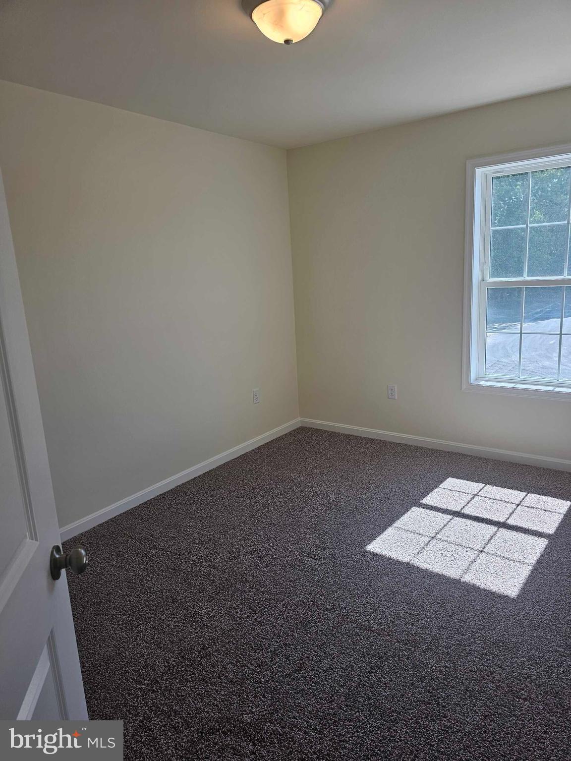 235 Rojan Road, Unit 111 Dover, DE 19901 - Photo 11 of 15 an empty room with a window