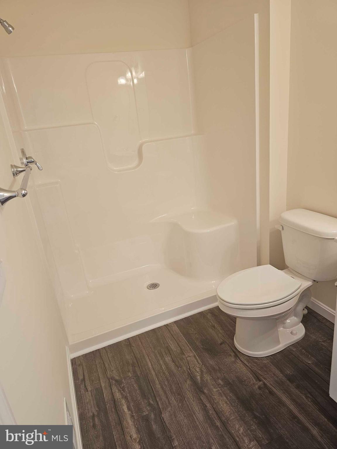 235 Rojan Road, Unit 111 Dover, DE 19901 - Photo 15 of 15 a bathroom with a toilet and a shower