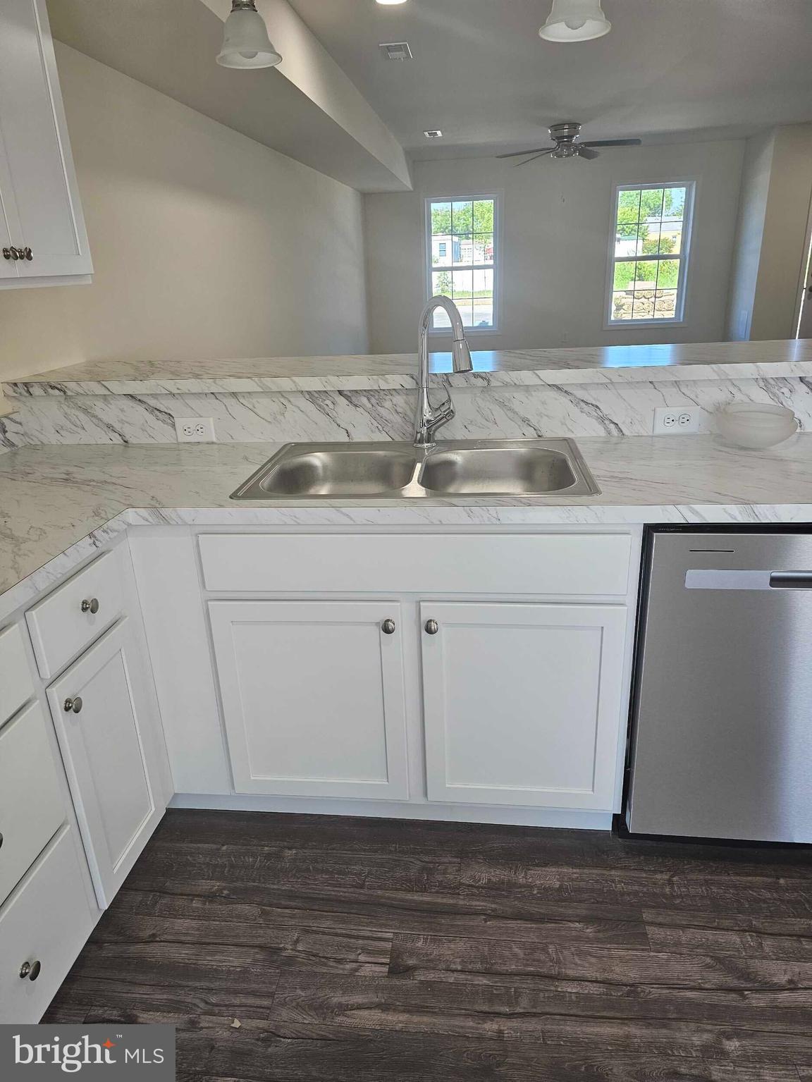 235 Rojan Road, Unit 111 Dover, DE 19901 - Photo 4 of 15 a view of a sink a mirror and cabinets