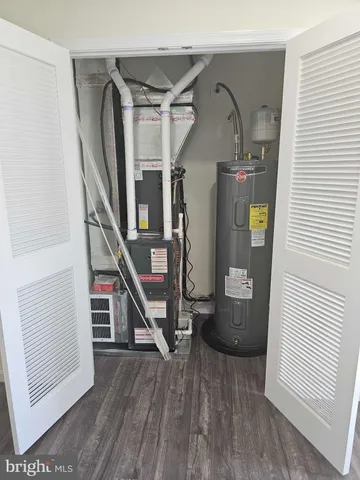 a view of entryway and workspace with wooden floor