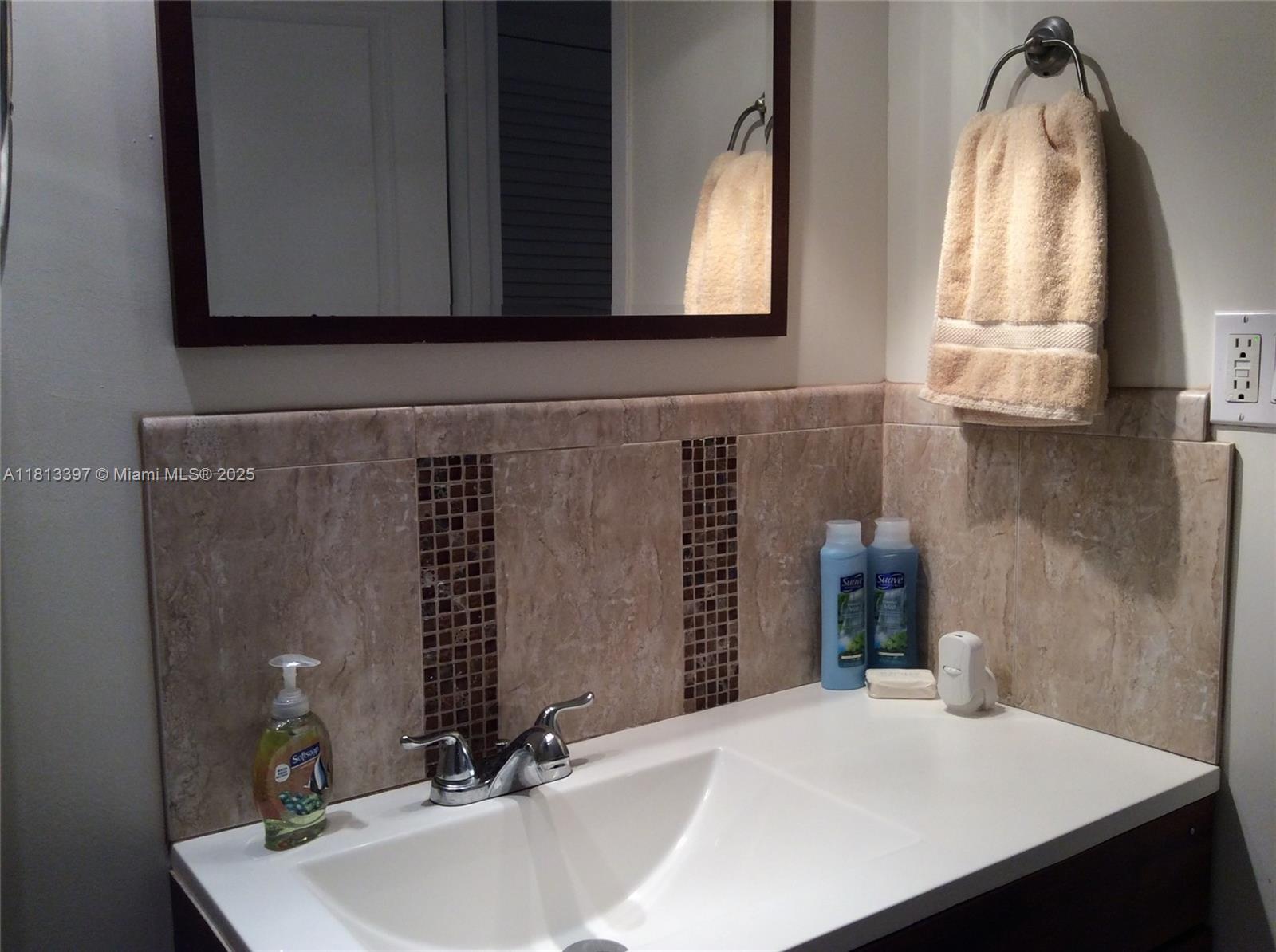 100 Lincoln Road, Unit 1214 Miami Beach, FL 33139 - Photo 5 of 17 a bathroom with a sink and a mirror