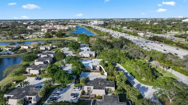 an aerial view of residential houses with outdoor space and river