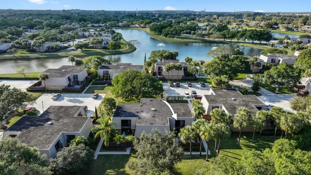 an aerial view of a house with a lake view