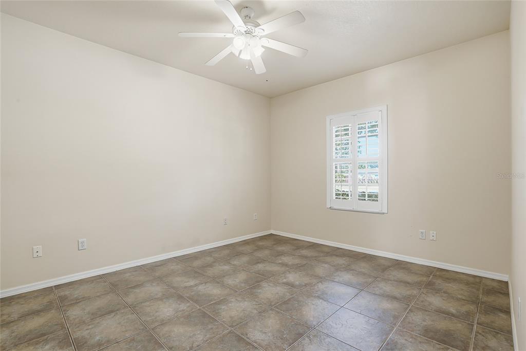 1934 Old Sawmill Road Brandon, FL 33510 - Photo 17 of 40 an empty room with windows and fan