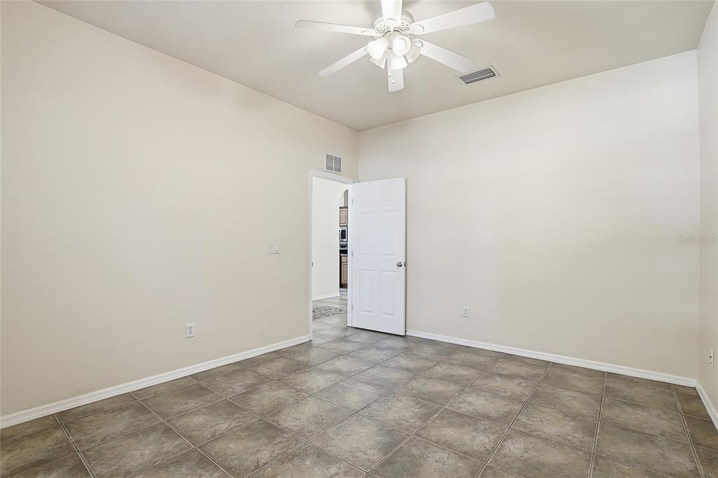 1934 Old Sawmill Road Brandon, FL 33510 - Photo 18 of 40 an empty room with a fan and a fan