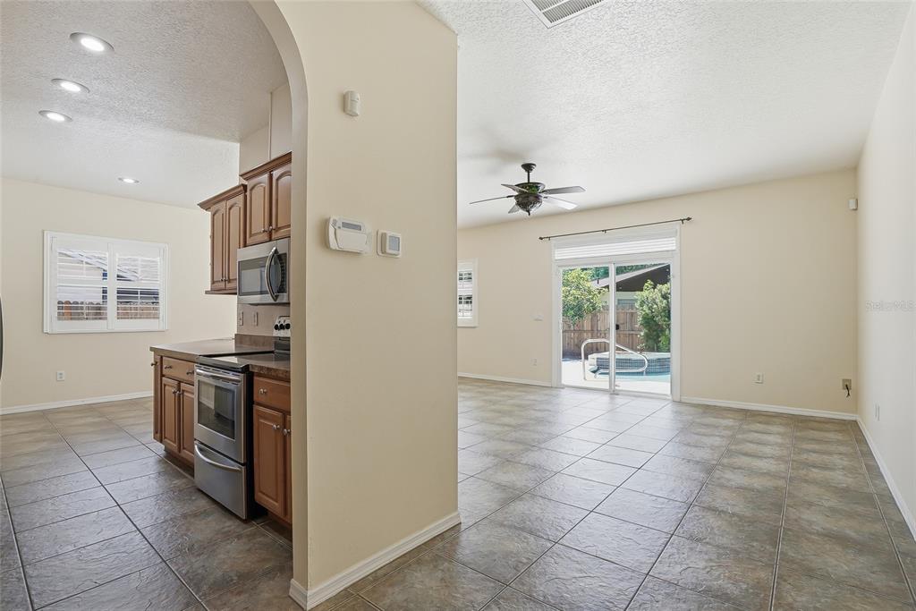 1934 Old Sawmill Road Brandon, FL 33510 - Photo 19 of 40 a view of a kitchen with an empty space and workspace