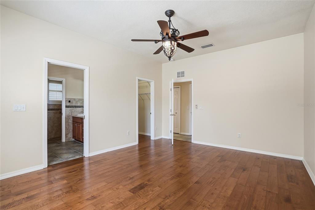 1934 Old Sawmill Road Brandon, FL 33510 - Photo 22 of 40 a view of a room with wooden floor and ceiling fan