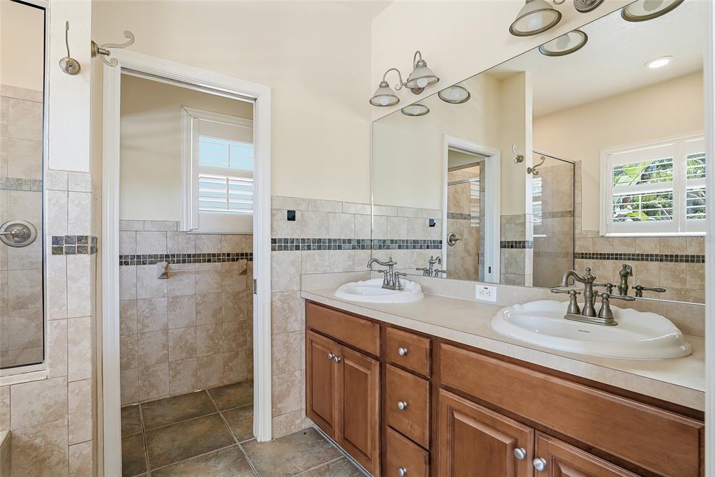 1934 Old Sawmill Road Brandon, FL 33510 - Photo 26 of 40 a bathroom with a sink shower and a mirror