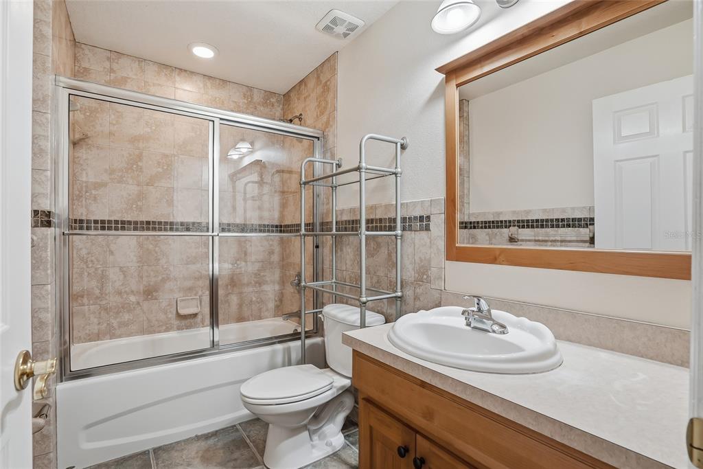 1934 Old Sawmill Road Brandon, FL 33510 - Photo 33 of 40 a bathroom with a sink toilet and shower