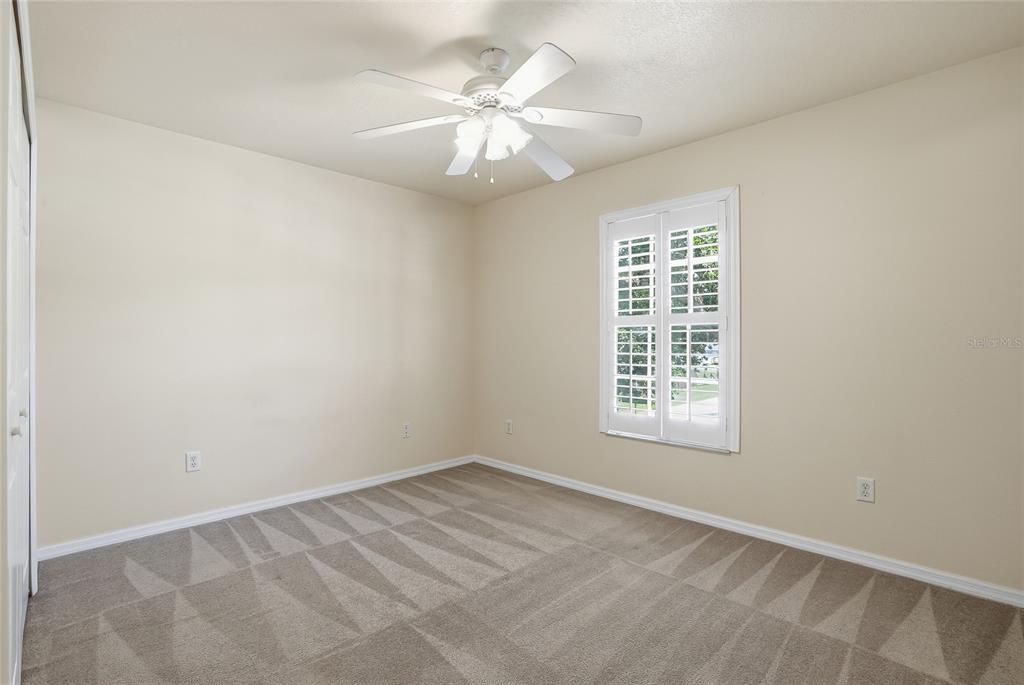1934 Old Sawmill Road Brandon, FL 33510 - Photo 34 of 40 an empty room with a window and a fan
