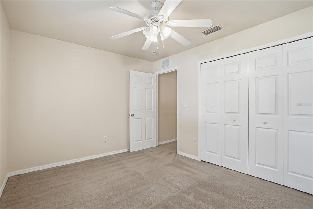 1934 Old Sawmill Road Brandon, FL 33510 - Photo 35 of 40 an empty room with a chandelier fan