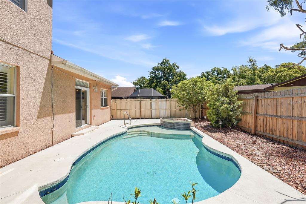 1934 Old Sawmill Road Brandon, FL 33510 - Photo 40 of 40 a swimming pool with outdoor seating and yard