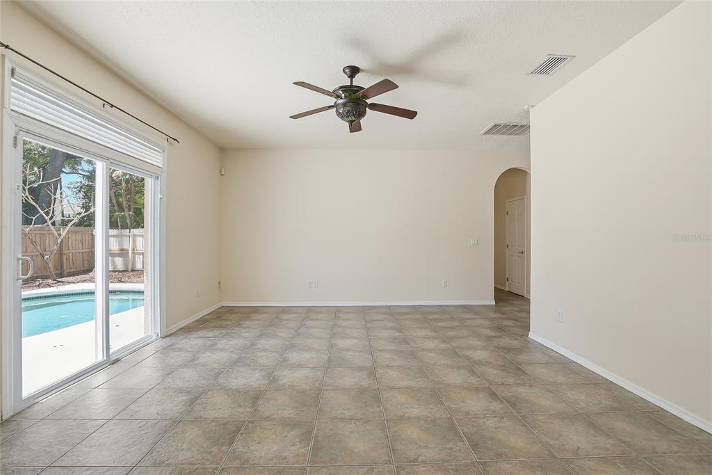 1934 Old Sawmill Road Brandon, FL 33510 - Photo 9 of 40 a view of a livingroom with a ceiling fan and window