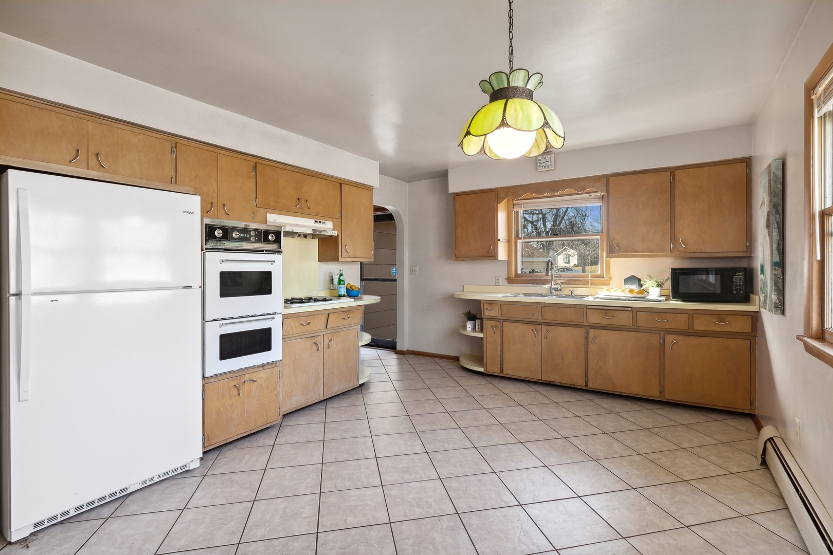 26075 Riverview Drive Antioch, IL 60002 - Photo 15 of 41 a kitchen with a stove a sink and a refrigerator