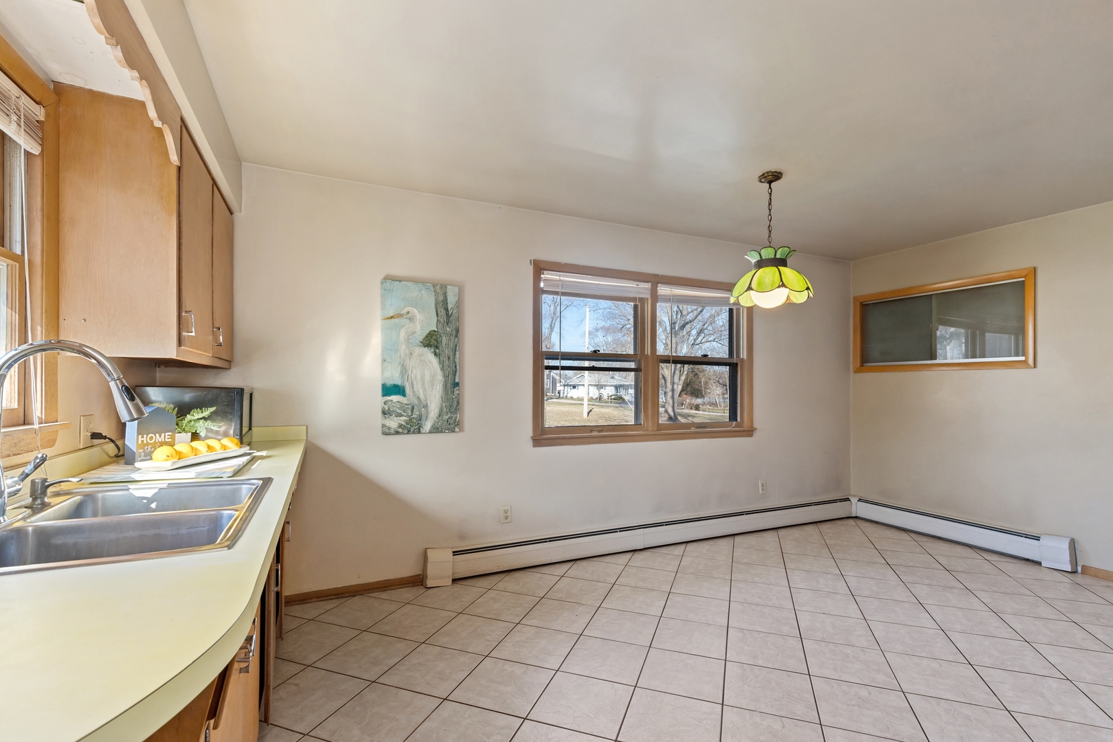 26075 Riverview Drive Antioch, IL 60002 - Photo 16 of 41 a view of a kitchen sink and microwave