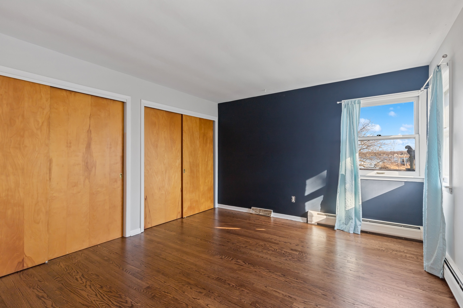 26075 Riverview Drive Antioch, IL 60002 - Photo 18 of 41 wooden floor in an empty room with a window