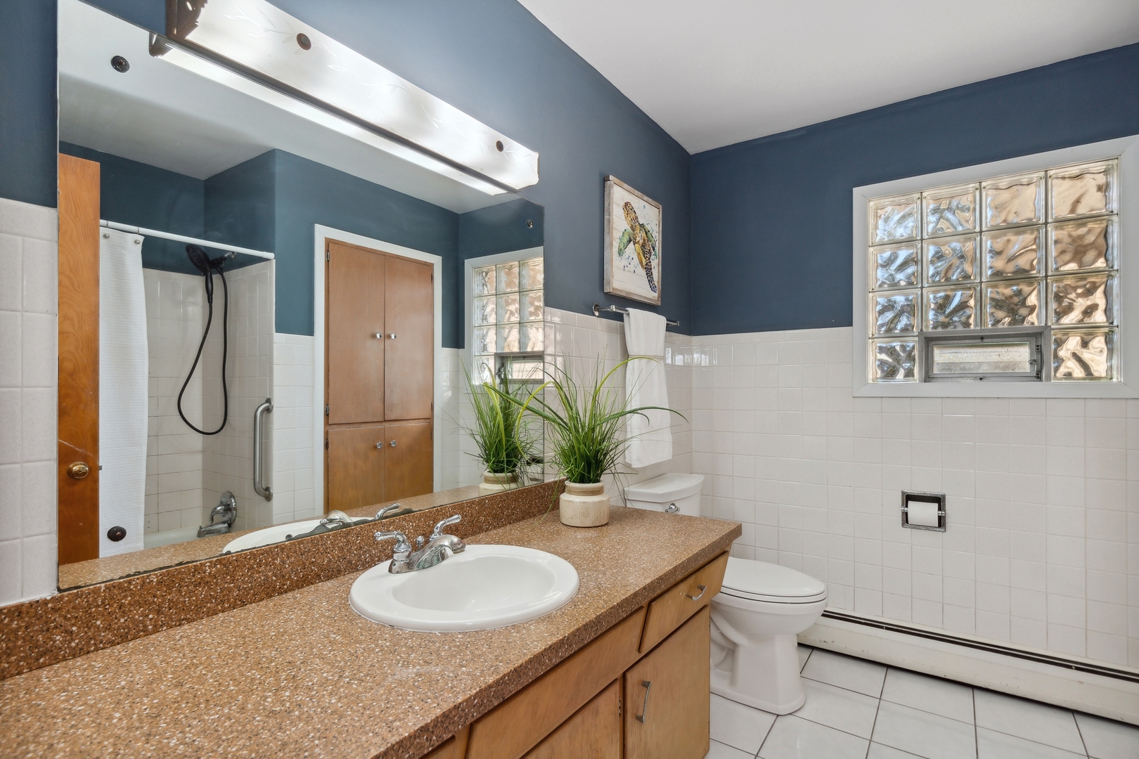 26075 Riverview Drive Antioch, IL 60002 - Photo 19 of 41 a bathroom with a granite countertop sink and a mirror