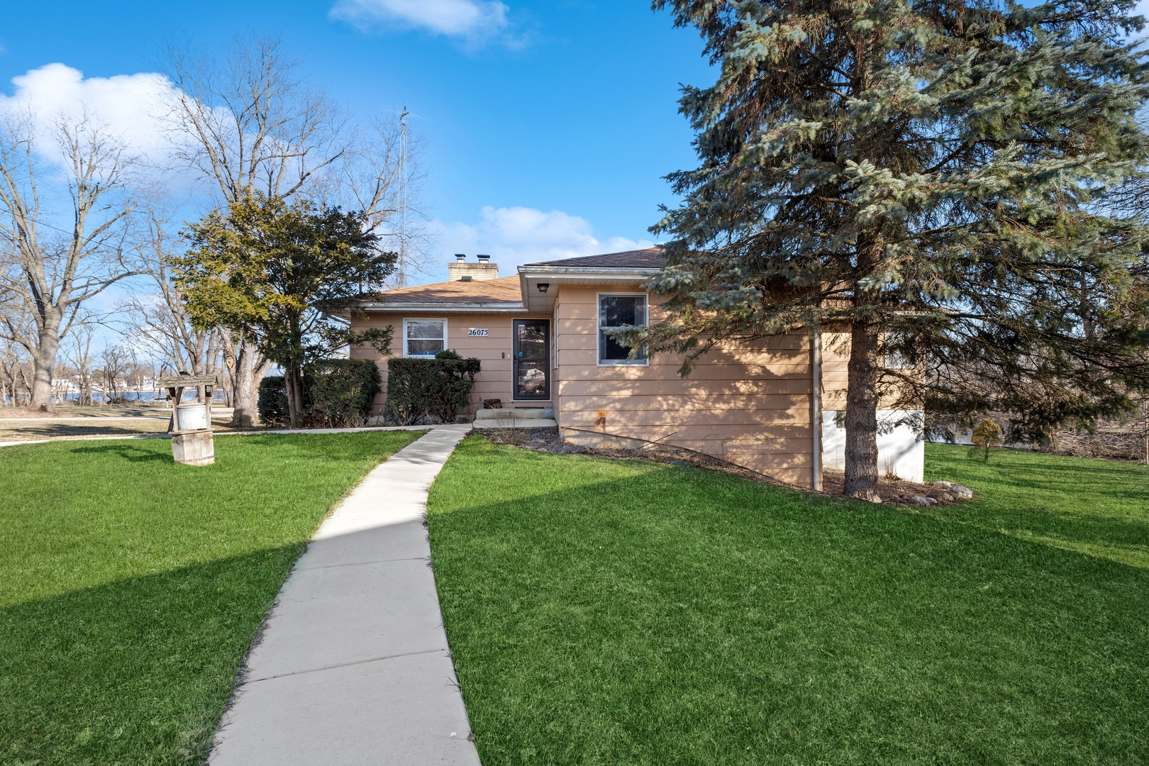 26075 Riverview Drive Antioch, IL 60002 - Photo 2 of 41 a front view of a house with a yard and tree