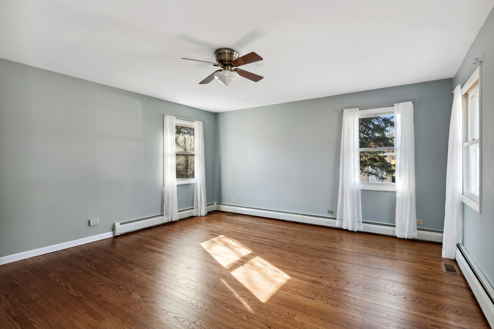 26075 Riverview Drive Antioch, IL 60002 - Photo 21 of 41 a view of an empty room with wooden floor and window