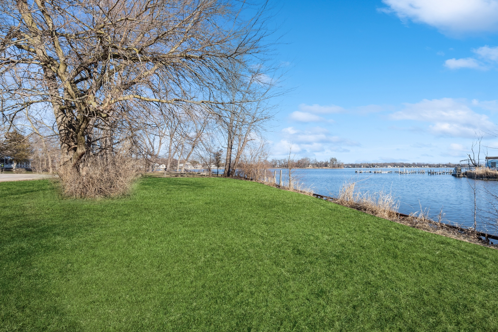 26075 Riverview Drive Antioch, IL 60002 - Photo 28 of 41 a view of a lake with houses in back