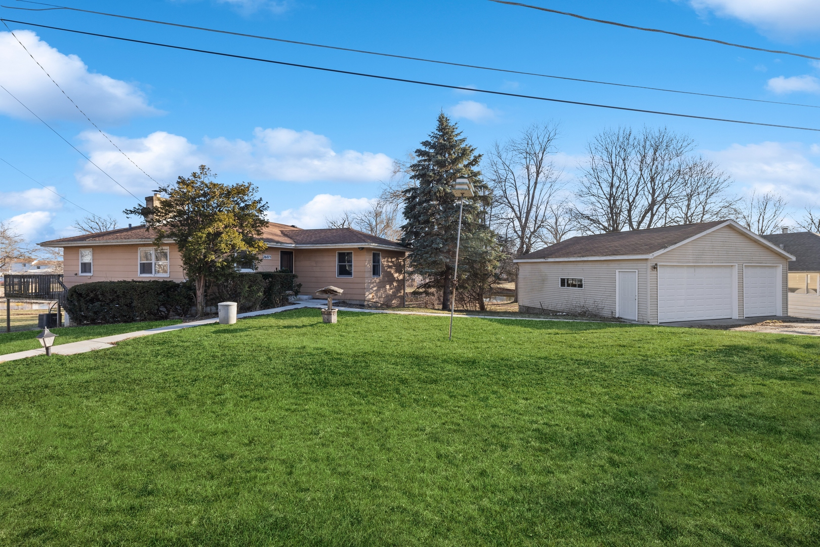 26075 Riverview Drive Antioch, IL 60002 - Photo 3 of 41 a front view of house with a garden